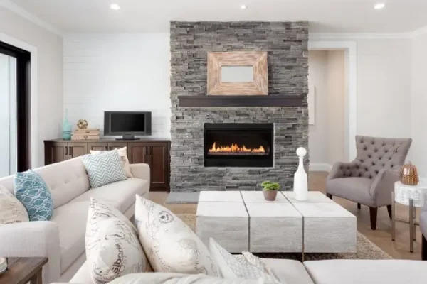 Beautiful living room interior with hardwood floors and fireplace in new luxury home.