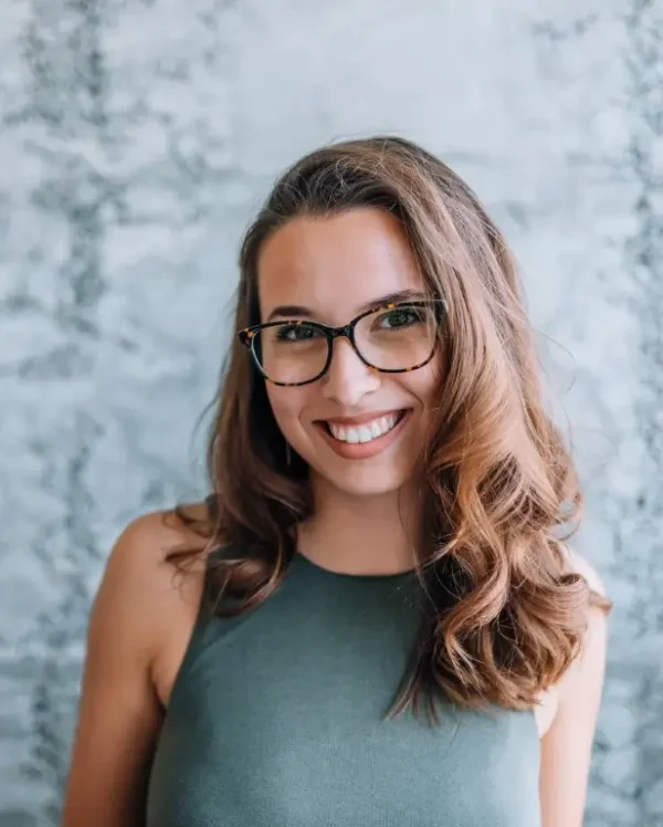 Headshot of gorgeous young woman with eyeglasses.
