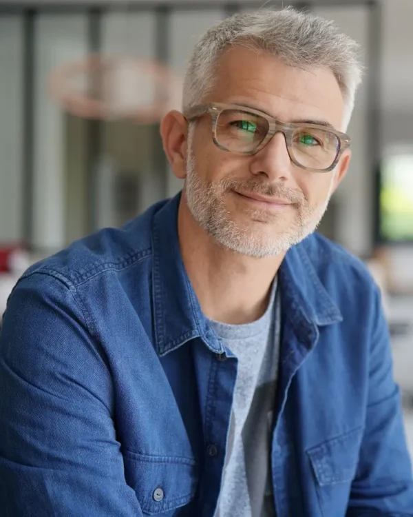 Middle-aged guy with eyeglasses and blue shirt
